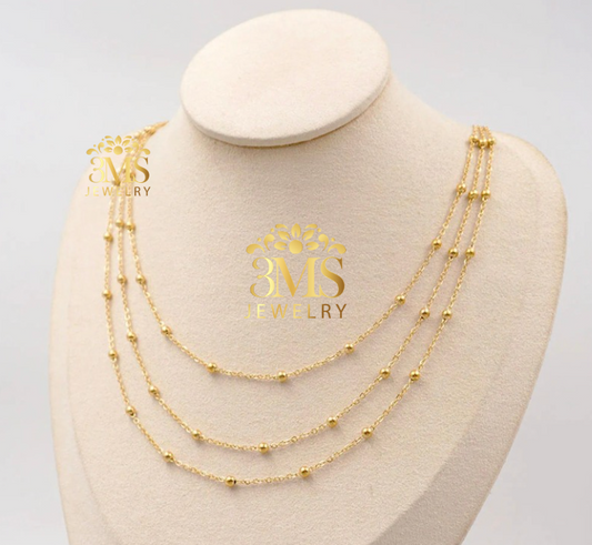 "18K gold three-layer beads necklace in titanium steel with gold vermeil—front-side details"