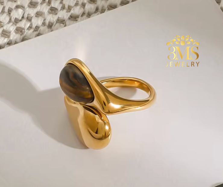 "18K gold ring with natural tiger eye oval shape in titanium steel with gold vermeil—side-by-side view"