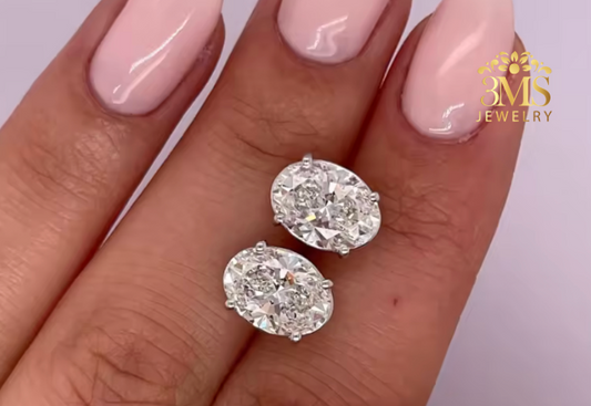 "Lab diamond Oval-cut stud earrings in 4-prong settings with 14K white gold—in front zoom angle view"