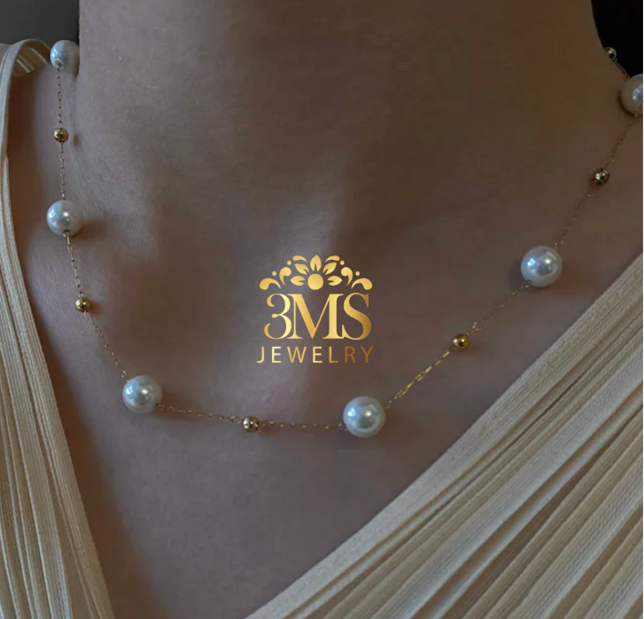 "18K gold pearl necklace with bead design in titanium steel with gold vermeil—neck-wearing view"