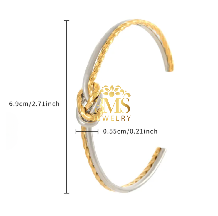 "18K gold knot open bangle bracelet in titanium steel with white gold and yellow gold vermeil—side size details view"