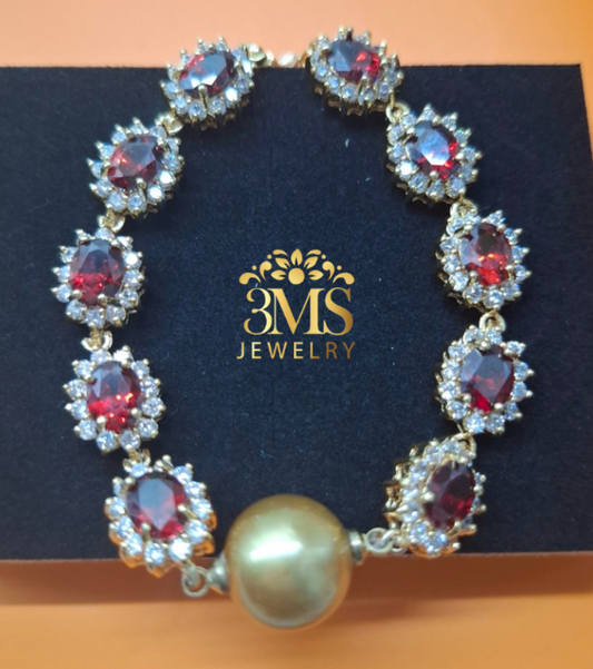 NATURAL GARNET & DEEP GOLDEN SOUTH SEA PEARL