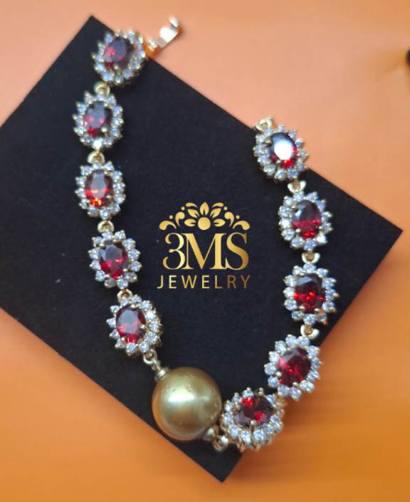 NATURAL GARNET & DEEP GOLDEN SOUTH SEA PEARL