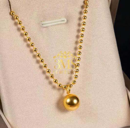 "18K gold beaded pendant necklace in titanium with gold vermeil—front view"