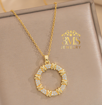 "18K gold x design with white zircon stone in titanium steel with gold vermeil - front view"