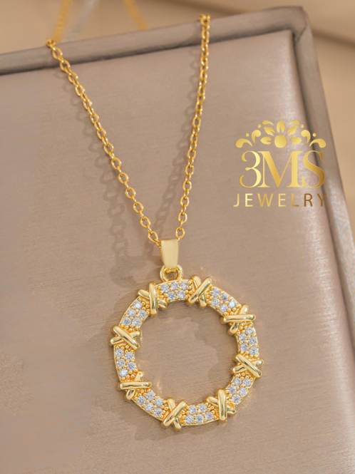 "18K gold round x design with white zircon stone in titanium steel with gold vermeil - front details"