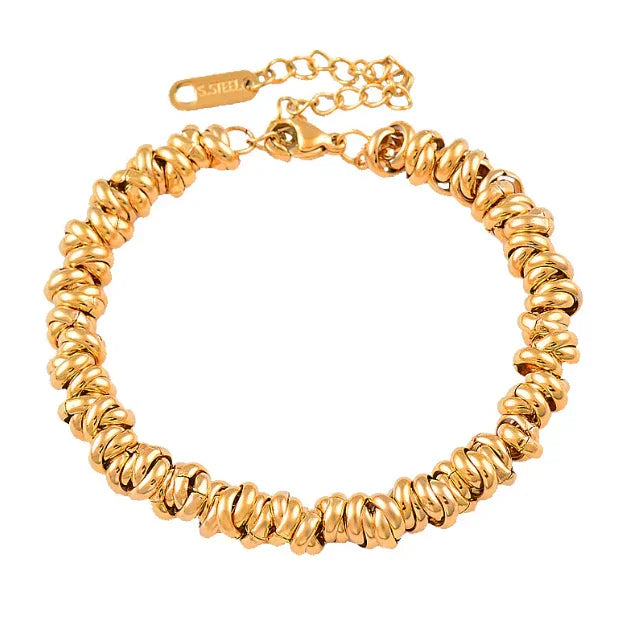 Gold-tone stainless steel bracelet with textured, irregular round beads and adjustable chain clasp