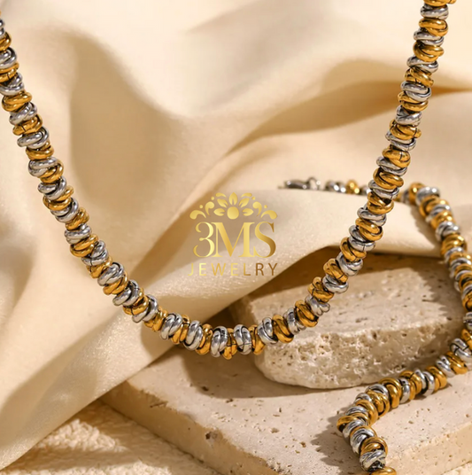 "18K gold two-color necklace in a titanium steel with gold vermeil  - front view"
