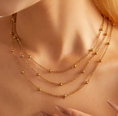 "Three-layer gold necklace with small round beads with 18k gold vermeil—on wearing, full front view"