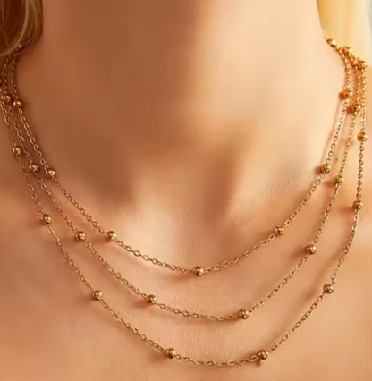 "Three-layer gold necklace with small round beads with 18k gold vermeil—on neck, wearing, full front view"