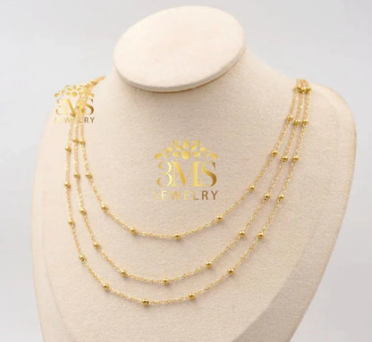"Three-layer gold necklace with small round beads with 18k gold vermeil -side front view"