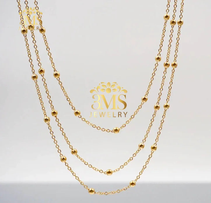 "Three-layer gold necklace with small round beads with 18k gold vermeil—front view"