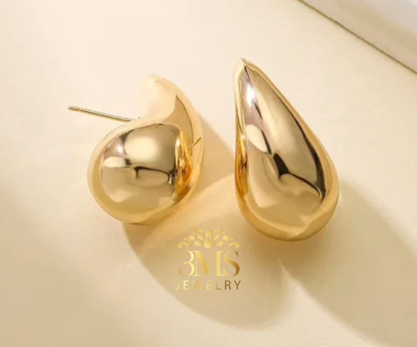 "18K gold teardrop stud earring in titanium steel with gold vermeil—front & side view"
