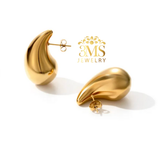 "18K gold teardrop stud earring in titanium steel with gold vermeil—side-by-side view"