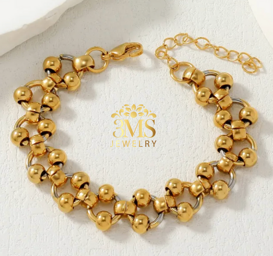 "18K gold lock beads in titanium steel with gold vermeil—front view"