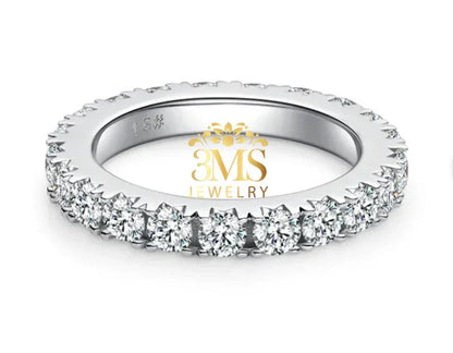 14K white gold eternity band with round moissanite stones in prong settings