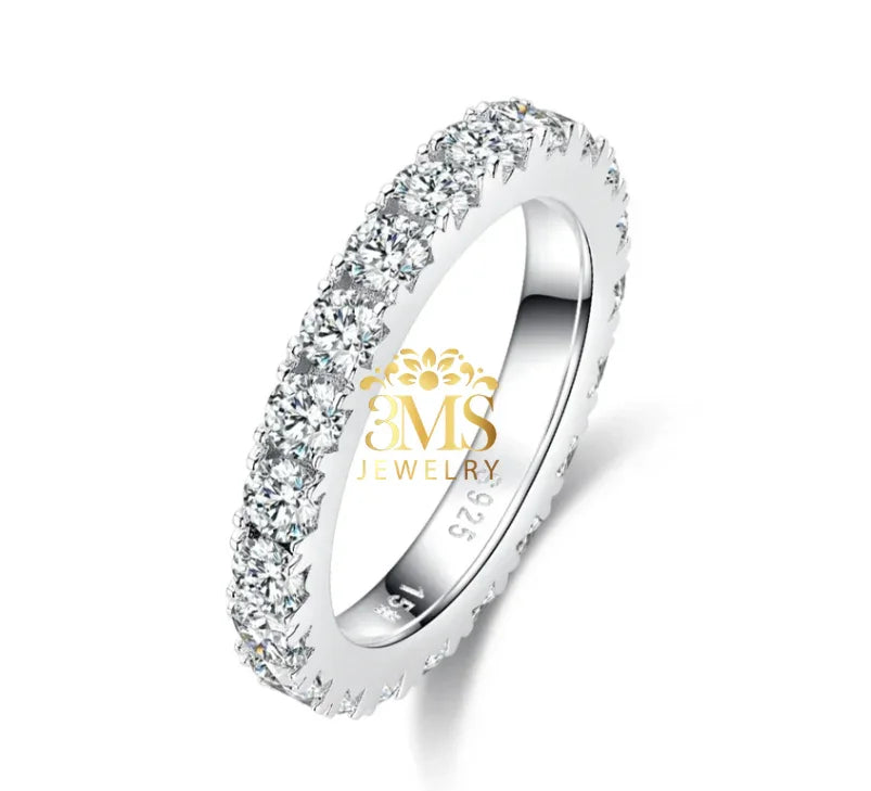 Silver eternity band ring with round moissanite stones set all around
