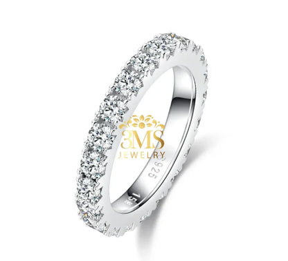 Silver eternity band ring with round moissanite stones set all around