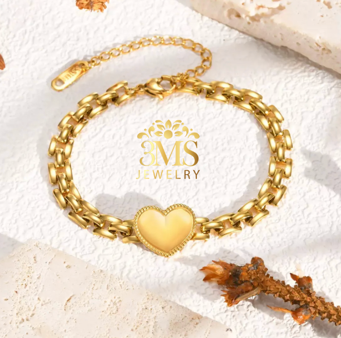 "18K gold heart pendant bracelet in titanium steel with gold vermeil - front full view"