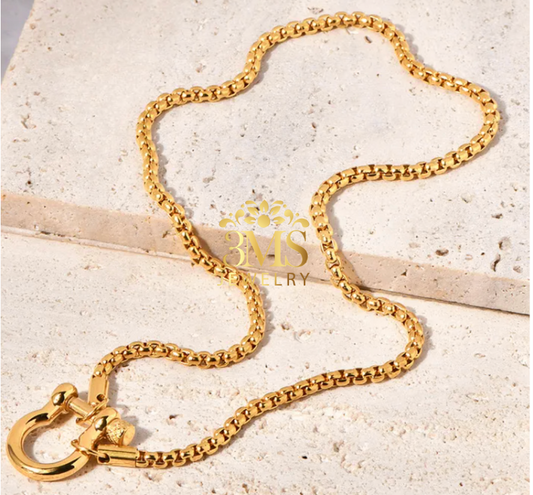 "18K gold interlock pendant necklace in titanium steel with gold vermeil- full view"