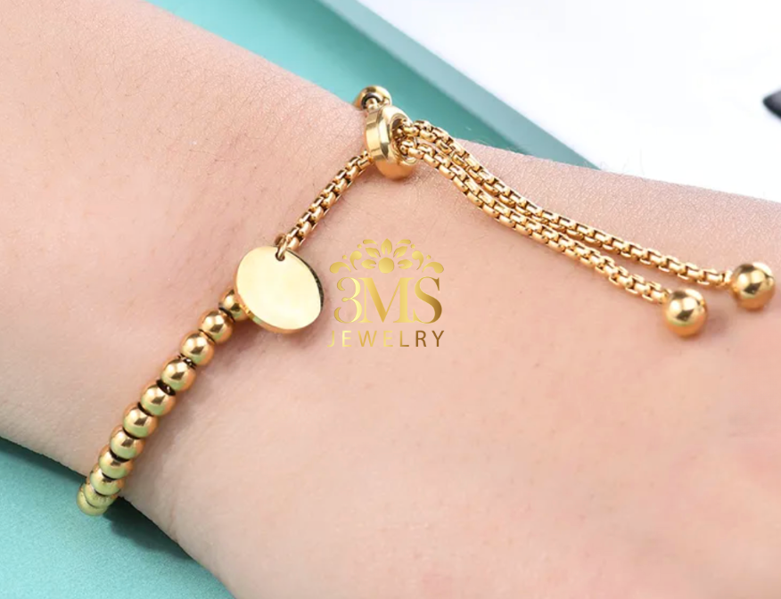 "18K gold bead bracelet in titanium steel with gold vermeil - on wearing  details"
