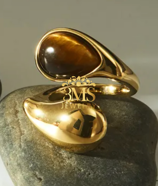 "18K gold ring with natural tiger eye oval shape in titanium steel with gold vermeil - front view"