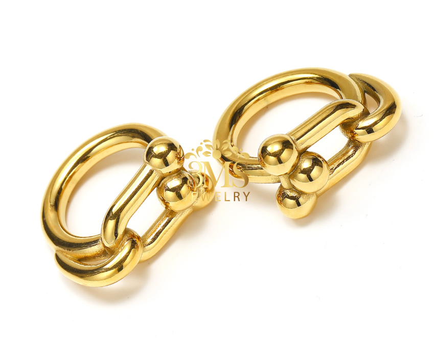 "18K gold link statement ring in titanium steel with gold vermeil—side-by-side view" 