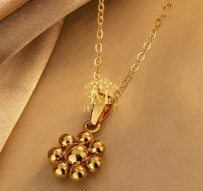 "18K gold beaded floral pendant  necklace in titanium steel with gold vermeil—side zoom view"