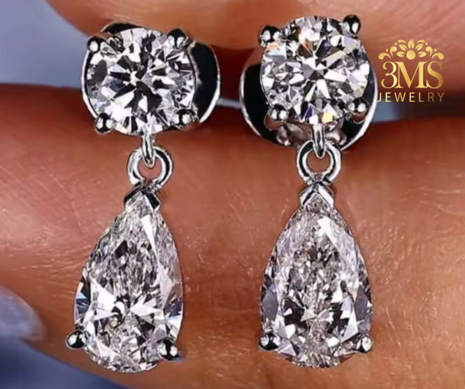 "Lab diamond round brilliant-cut and pear-cut drop earring in 14K white gold -close-up view."