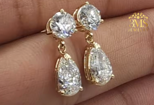 "Lab diamond round brilliant-cut and pear-cut drop earring in 14K yellow gold -side view."