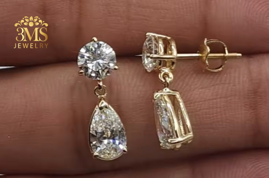 "Lab diamond round brilliant-cut and pear-cut drop earring in 14K yellow gold -fron-side view."