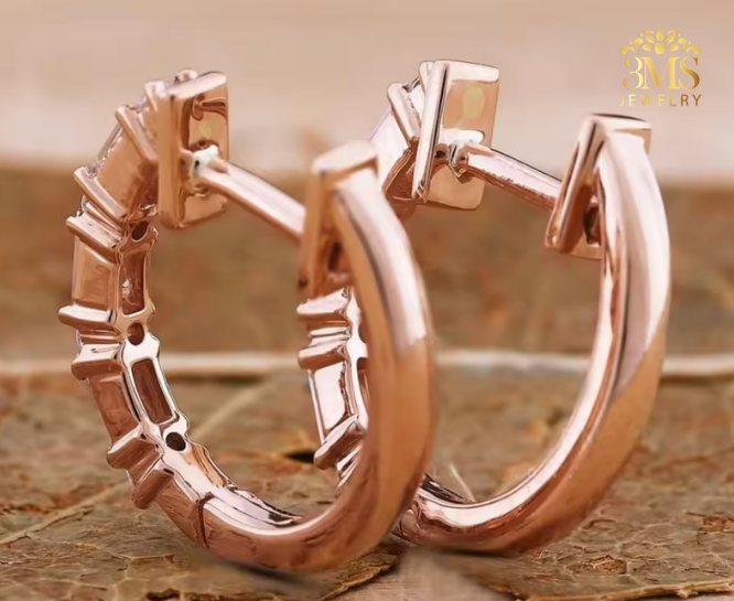 "Lab diamond baguette-cut hoop earring in rose gold—in close-up details view"