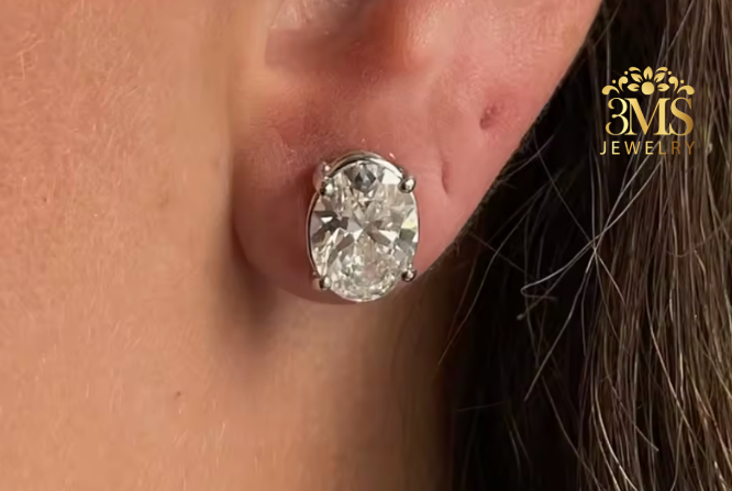 "Lab diamond Oval-cut stud earrings in 4-prong settings with 14K white gold on wearing —in front full view"