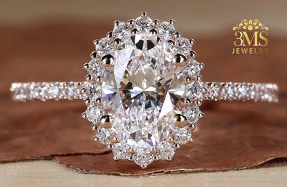 "Lab-created oval-cut diamond in a halo design set in 14K rose gold—front close-up view."