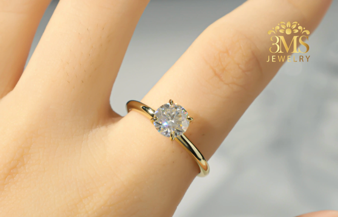 "Lab-grown round brilliant-cut diamond in a solitaire design set in 14K white gold—on wearing zoom view."