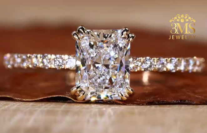"Lab diamond radiant-cut engagement ring in pave and 14K yellow gold settings—a close-up view."