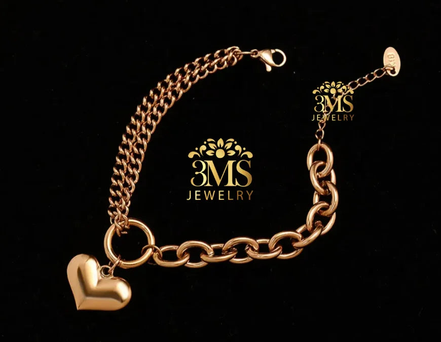 "18K gold chain bracelet with a heart charm in titanium steel with gold vermeil—side view"
