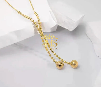 "18K gold two-beaded pendant necklace in titanium steel with gold vermeil—side view"