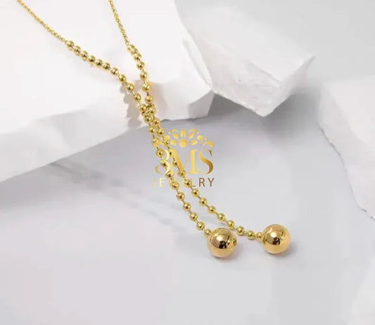 "18K gold two-beaded pendant necklace in titanium steel with gold vermeil—side view"