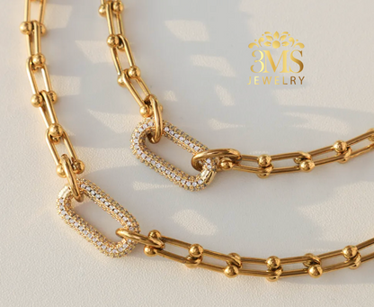 "18K gold link set necklace and bracelet in titanium steel with gold vermeil—front full view"