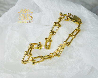 "18K gold chain necklace & bracelet set in stainless steel with gold vermeil side details"