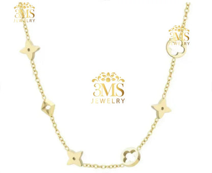 Delicate gold necklace with floral and geometric charms on a fine chain from 3MS Jewelry