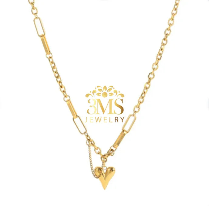Gold chain necklace with a unique heart-shaped pendant on white background