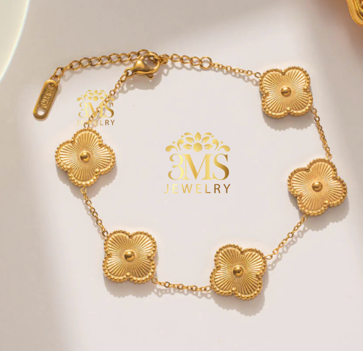 "18K gold leaf clover bracelet in titanium steel with gold vermeil—front full view"