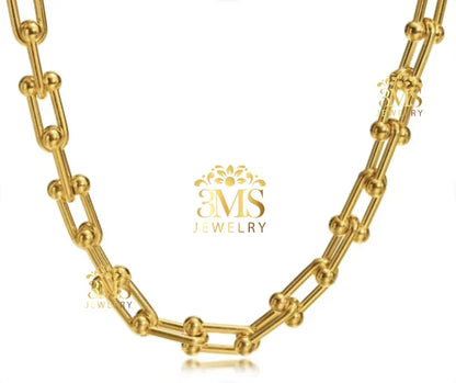 Gold chain necklace with unique linked bead design from 3MS Jewelry on white background