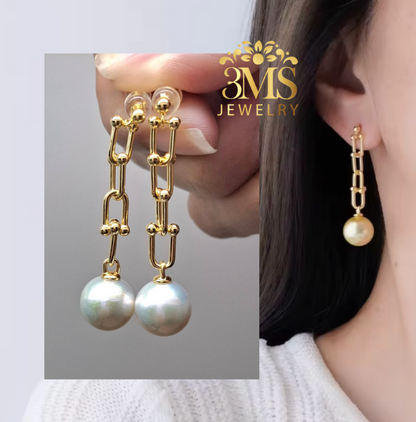 "18K gold chain link dangling earrings with 12mm white perfect round edison freshwater pearls in sterling silver with gold vermeil - on wearing details"