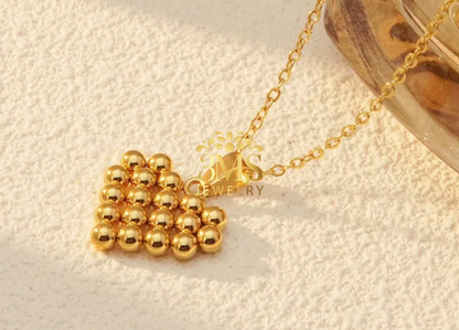 "18K gold beaded heart-shaped  pendant necklace in titanium steel with gold vermeil—side view"