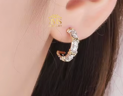 "1,0 ct. VVS1 flawless/colorless moissanite earrings in sterling silver with white gold and yellow gold vermeil - on ear wearing view"