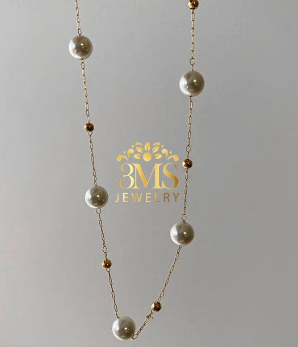 "18K gold pearl necklace with bead design in titanium steel with gold vermeil—zoom view"