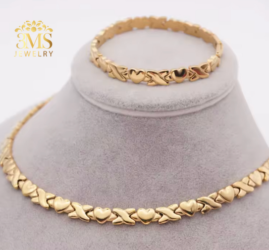 "Gold heart design necklace and bracelet in 18k gold vermeil—front view"